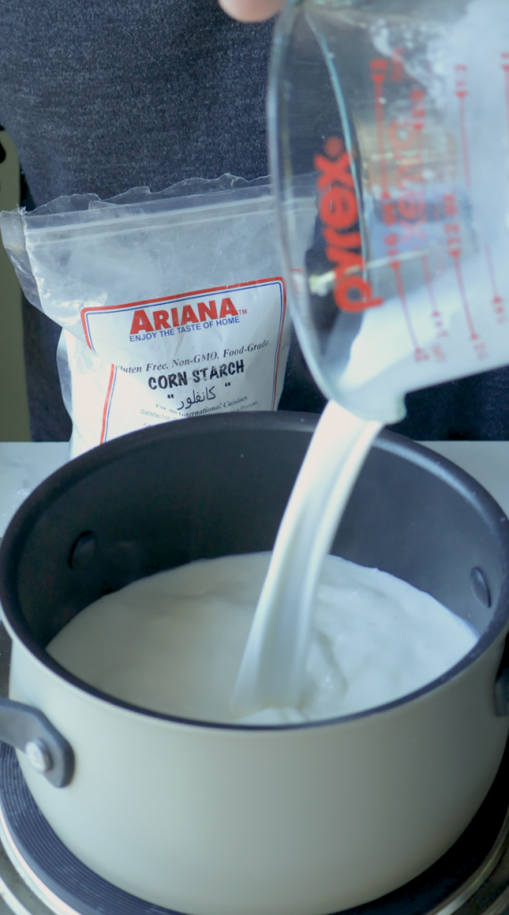 1. Start by measuring 2 cups whole milk. Pour one and half cups into a sauce pan.
2. Then the last half cup, mix with 1/3 cup corn starch.
3. Then add that into the sauce pan with the rest of the milk.